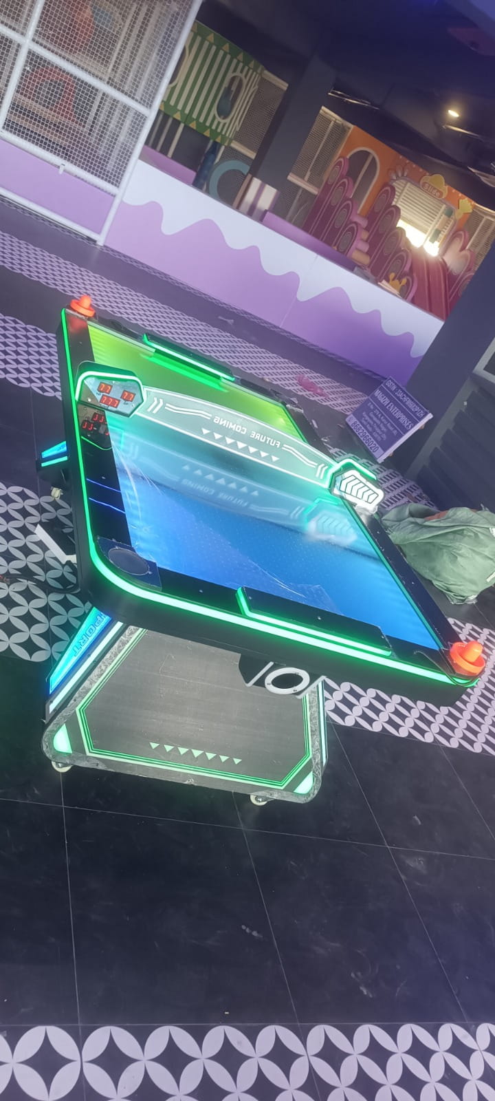 Neon air hockey table